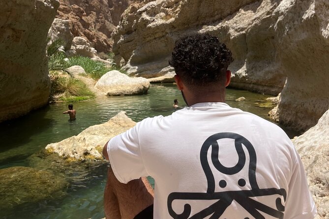 From Muscat Wadi Shab and Bimmah Sinkhole Tour - The boat crossing before the Wadi Shab hike