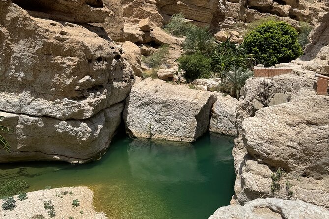 From Muscat Wadi Shab and Bimmah Sinkhole Tour - Hiking through the canyon to the pools