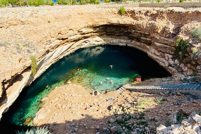 Full Day Group Tour to Wadi Shab Bimmah Sinkhole and Fins Beach - Bimmah Sinkhole offers a quick, photogenic stop