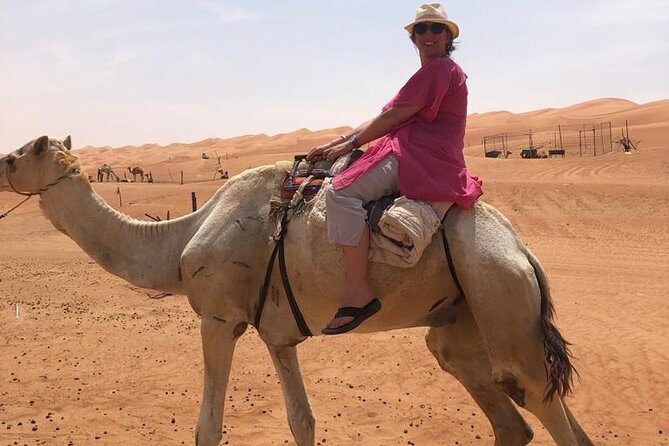 Full-Day Wahiba Desert and Wadi Bani Khalid Group Tour - Meeting a Bedouin family in the dunes