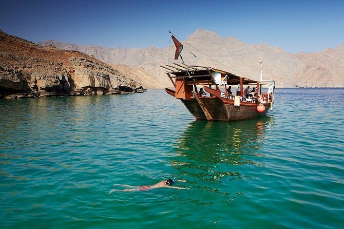 Khasab Musandam Half Day Dhow Cruise and Snorkeling Trip - Dolphin watching beside the dhow