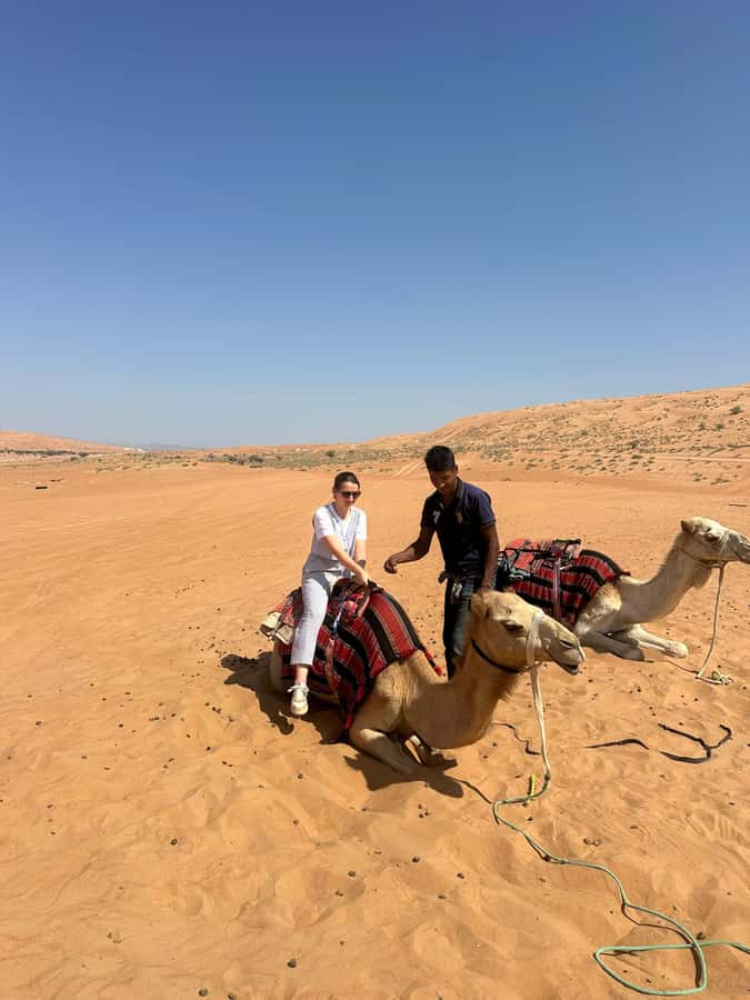 Muscat: Bidiya Desert Sunset Camel Ride with Transfer - What to bring for the 2:00 PM departure