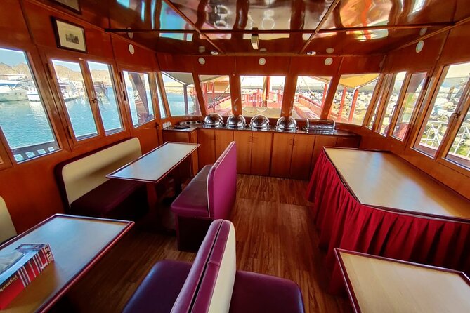 Omani Traditional Dhow Cruise: Sunset and Muscat Coastal View - A glimpse of Al Alam Palace
