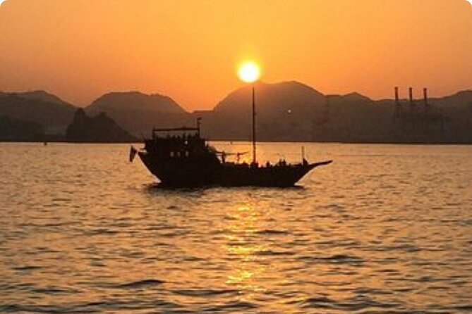 Omani Traditional Dhow Cruise: Sunset and Muscat Coastal View - Passing Al Bustan Palace from the sea