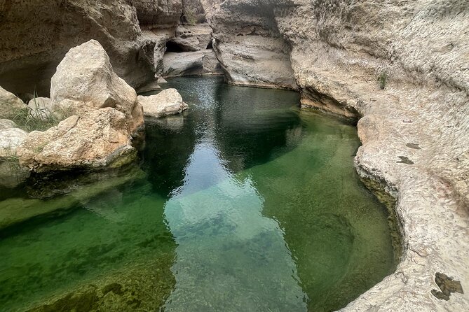 Private Day Trip to Wadi Shab, Fins Beach & Bimmah Sinkhole - Swimming through the pools and cave