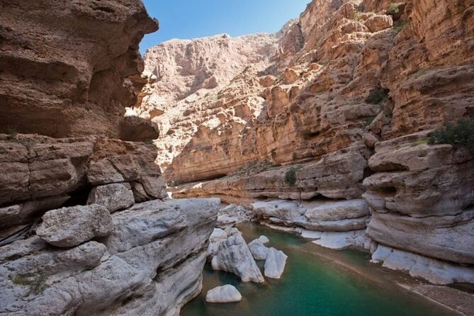 Private Full-Day Wadi Shab and Bimmah Sinkhole Tour - Fins Beach brings the coast back into view