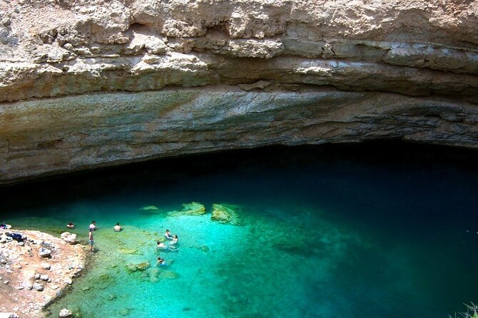 Wadi Shab and Bimmah Sinkhole 4X4 (Private Tour ) - Swimming into the keyhole and waterfall pool