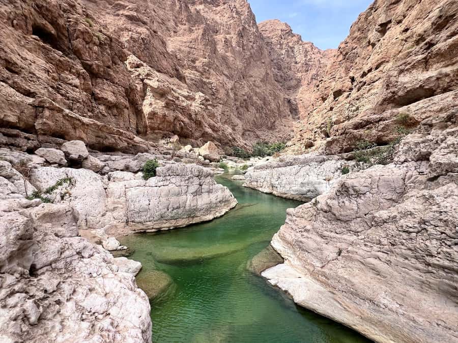 Wadi Shab & Wadi Tiwi : Guided Adventure (Customer Own Car) - Wadi Shab starts with a hike beside towering cliffs